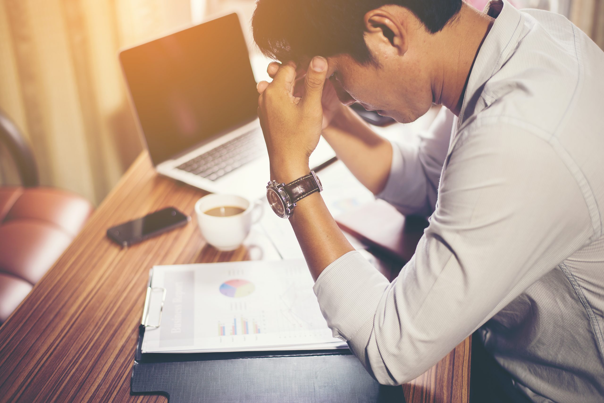 Serious businessman working with analysis financial at office.
